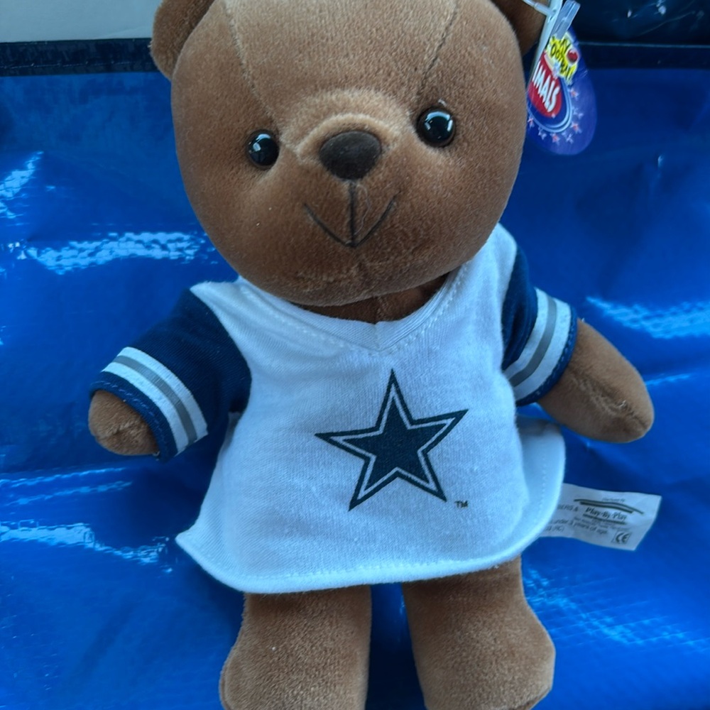Dallas Cowboys stuffed animal 8” x 7” with arm span, 4” diameter head. 1997